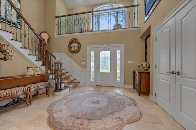 251 Wilmot Dr, Hewlett, NY 11557 - tiled foyer with a high ceiling, healthy amount of natural light, and stairway