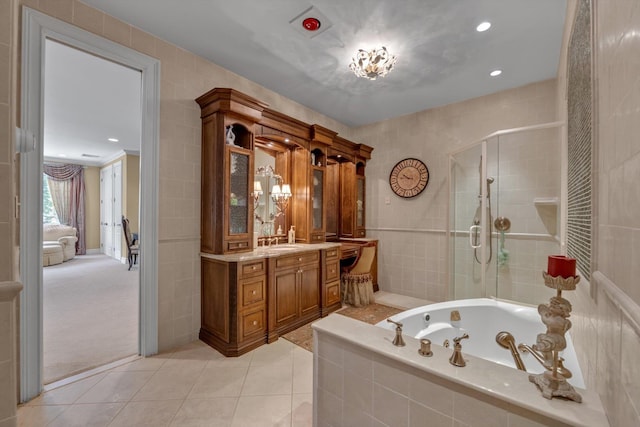 251 Wilmot Dr, Hewlett, NY 11557 - ensuite bathroom with vanity, a bath, a stall shower, tile patterned flooring, and recessed lighting