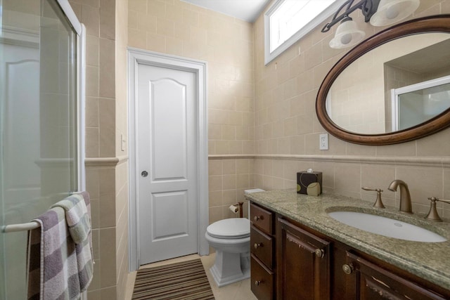 251 Wilmot Dr, Hewlett, NY 11557 - bathroom with tile walls, vanity, a stall shower, toilet, and tile patterned floors