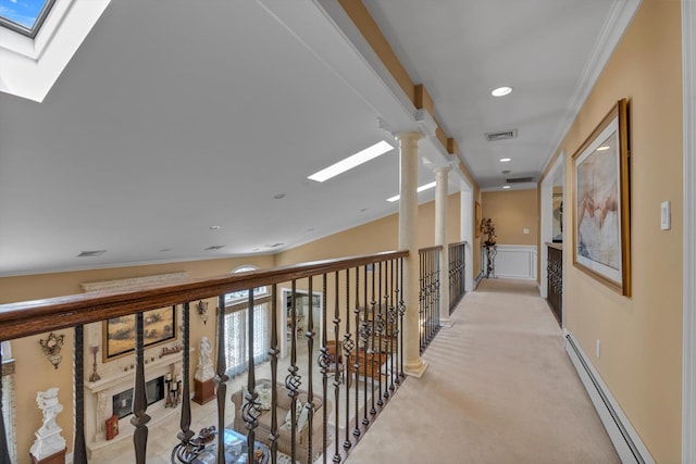 251 Wilmot Dr, Hewlett, NY 11557 - hallway with a skylight, a baseboard heating unit, light carpet, ornamental molding, and recessed lighting