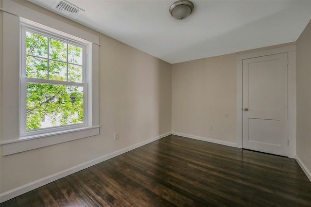 506 Raynor Ave, Riverhead, NY 11901 - spare room with baseboards and dark wood finished floors
