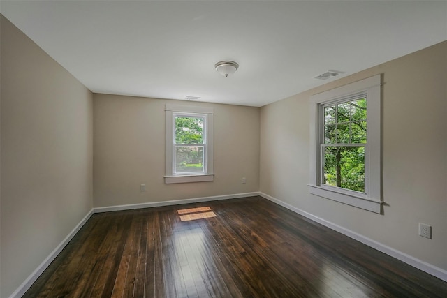 506 Raynor Ave, Riverhead, NY 11901 - spare room with plenty of natural light, dark wood-style floors, and baseboards