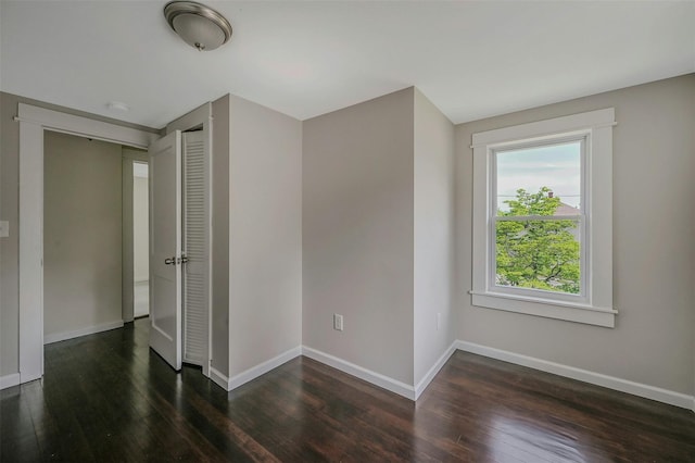 506 Raynor Ave, Riverhead, NY 11901 - spare room with wood finished floors, baseboards, and a smoke detector