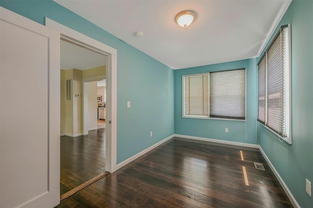 506 Raynor Ave, Riverhead, NY 11901 - unfurnished room with wood finished floors, a smoke detector, and baseboards