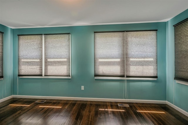 506 Raynor Ave, Riverhead, NY 11901 - unfurnished room with dark wood-style floors and baseboards