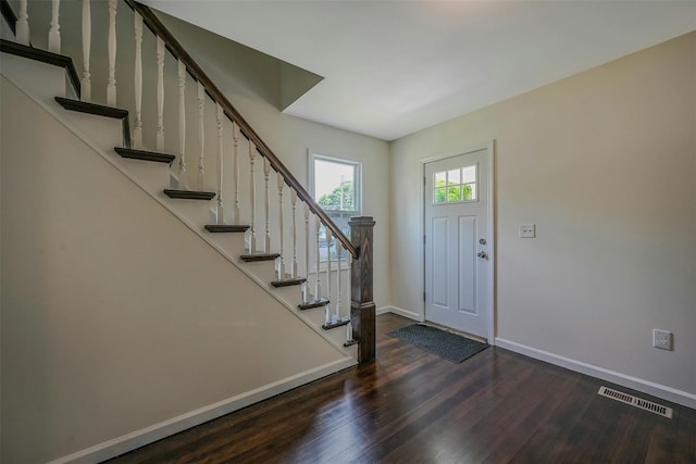 506 Raynor Ave, Riverhead, NY 11901 - entryway featuring wood finished floors, baseboards, and stairway