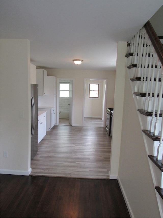 506 Raynor Ave, Riverhead, NY 11901 - kitchen featuring freestanding refrigerator, wood finished floors, and baseboards