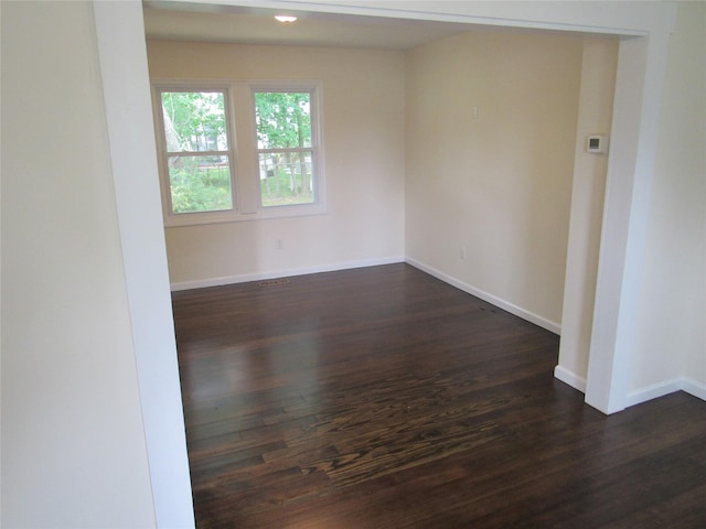 506 Raynor Ave, Riverhead, NY 11901 - unfurnished room with dark wood-style flooring and baseboards
