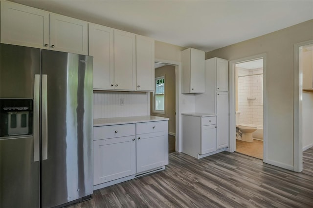 506 Raynor Ave, Riverhead, NY 11901 - kitchen featuring stainless steel fridge with ice dispenser, dark wood-style flooring, and white cabinets