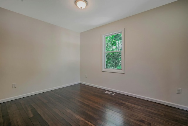 506 Raynor Ave, Riverhead, NY 11901 - spare room with dark wood finished floors and baseboards