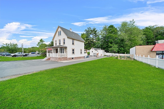 31 Forestburgh Rd, Monticello, NY 12701 - back of house with covered porch, a chimney, and a shingled roof