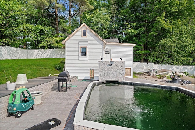 31 Forestburgh Rd, Monticello, NY 12701 - view of pool featuring an outdoor structure, a patio area, and view of scattered trees