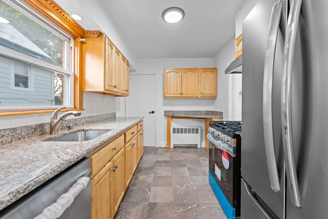 8043 Utopia Pkwy, Jamaica Estates, NY 11432 - kitchen featuring stainless steel appliances, radiator heating unit, a sink, light brown cabinetry, and stone finish floors
