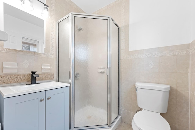 8043 Utopia Pkwy, Jamaica Estates, NY 11432 - bathroom featuring tile walls, vanity, toilet, and a shower stall