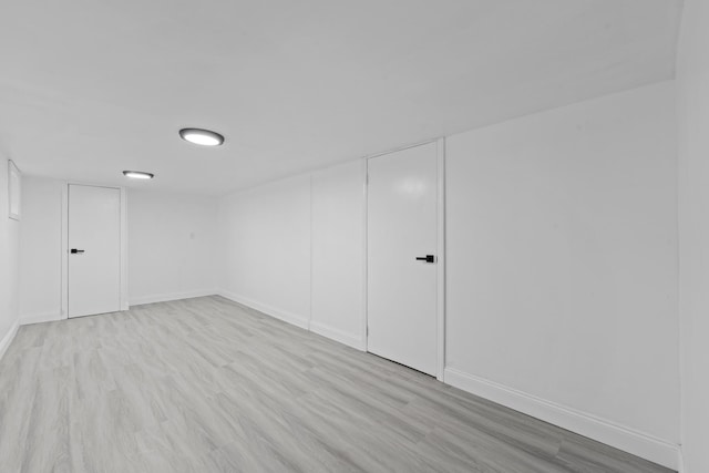 8043 Utopia Pkwy, Jamaica Estates, NY 11432 - finished basement with light wood finished floors and baseboards