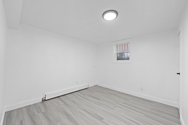 8043 Utopia Pkwy, Jamaica Estates, NY 11432 - spare room featuring baseboard heating, baseboards, and wood finished floors