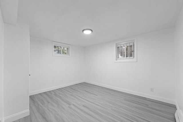 8043 Utopia Pkwy, Jamaica Estates, NY 11432 - below grade area with baseboards and wood finished floors