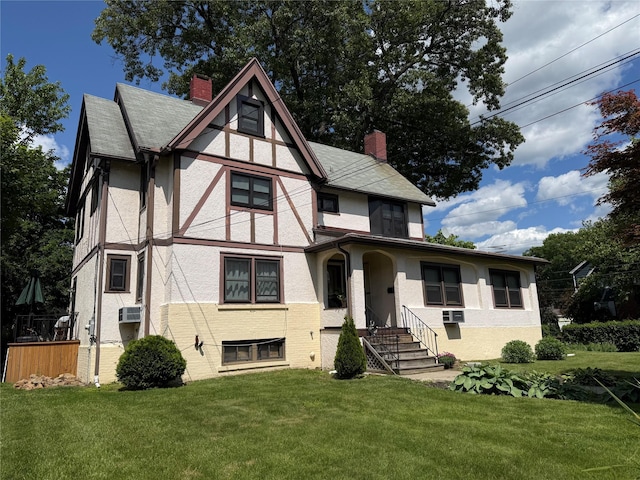25 Midland Ave, White Plains, NY 10606 - english style home featuring a chimney, stucco siding, and a front lawn