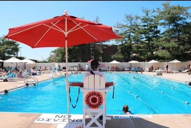 12-08 Robin Ln Unit 11-L, Bayside, NY 11360 - community pool with a patio area