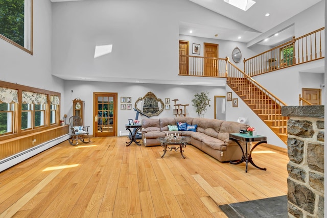 65 Oxford Springs Rd, Chester, NY 10918 - living room featuring high vaulted ceiling, a skylight, hardwood / wood-style floors, stairway, and recessed lighting