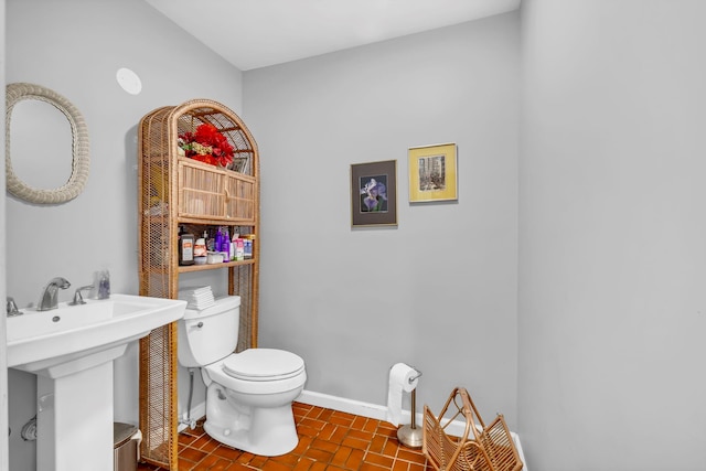 65 Oxford Springs Rd, Chester, NY 10918 - half bathroom with toilet and brick patterned floors