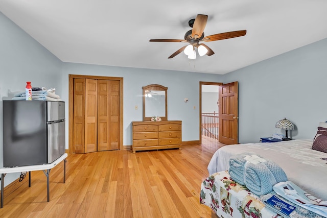 65 Oxford Springs Rd, Chester, NY 10918 - bedroom with freestanding refrigerator, light wood-style floors, a closet, and ceiling fan