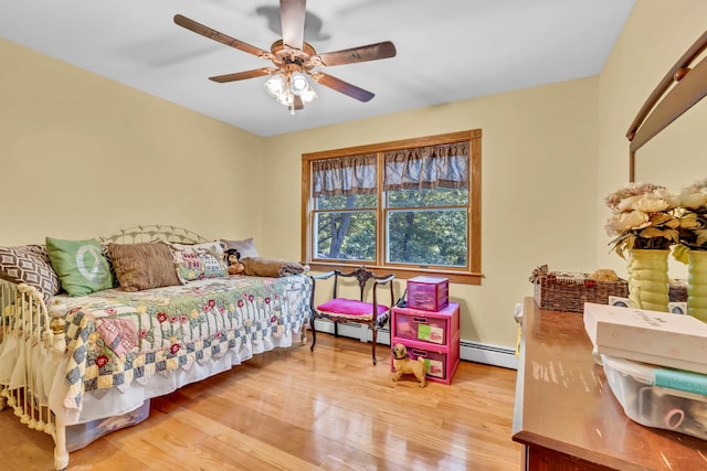 65 Oxford Springs Rd, Chester, NY 10918 - bedroom with baseboard heating, light wood-style floors, and ceiling fan