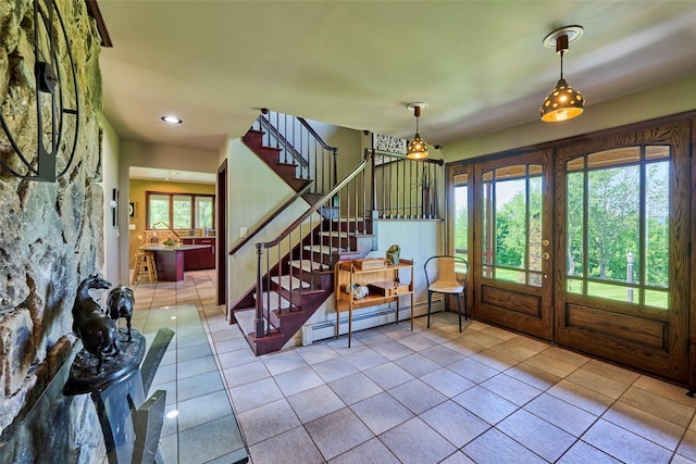 99 Dietz Rd, Jeffersonville, NY 12748 - tiled entrance foyer with a baseboard heating unit, stairs, and recessed lighting