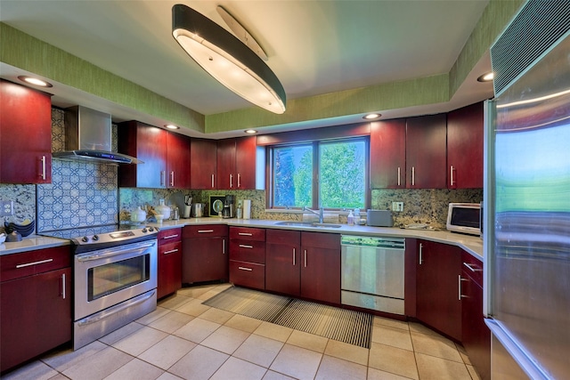 99 Dietz Rd, Jeffersonville, NY 12748 - kitchen featuring stainless steel appliances, wall chimney exhaust hood, decorative backsplash, light countertops, and light tile patterned floors