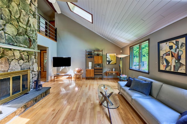 99 Dietz Rd, Jeffersonville, NY 12748 - living area with a skylight, wood finished floors, high vaulted ceiling, a fireplace, and wooden ceiling