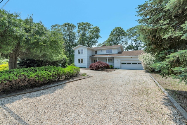 2000 Beebe Dr, Cutchogue, NY 11935 - view of front of house with a garage, driveway, and roof with shingles