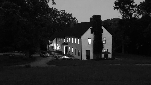 view of front facade featuring a chimney