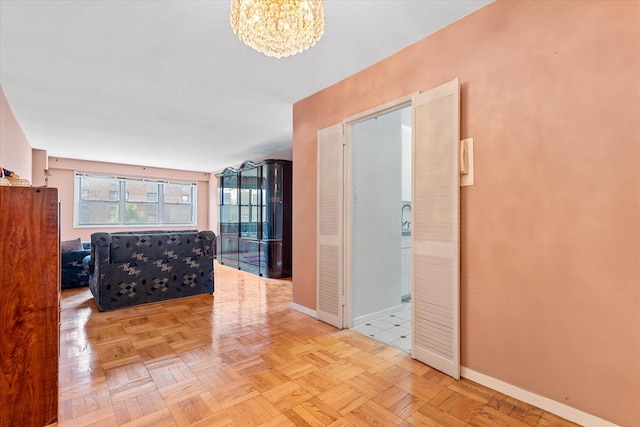 102-30 66th Rd Unit 4B, Forest Hills, NY 11375 - corridor featuring baseboards and a chandelier