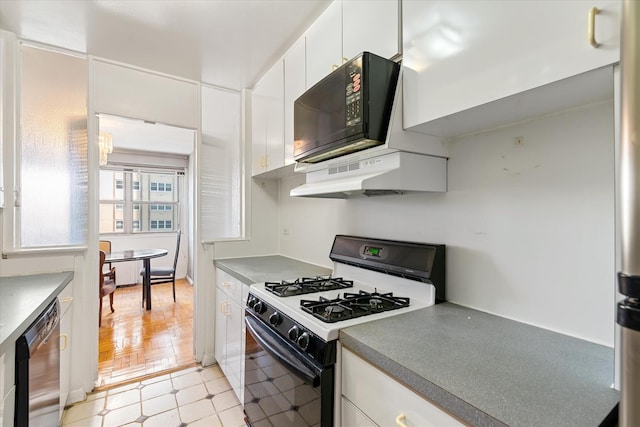 102-30 66th Rd Unit 4B, Forest Hills, NY 11375 - kitchen with range with gas cooktop, stainless steel dishwasher, under cabinet range hood, white cabinets, and black microwave