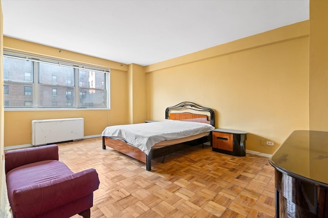 102-30 66th Rd Unit 4B, Forest Hills, NY 11375 - bedroom with baseboards and radiator