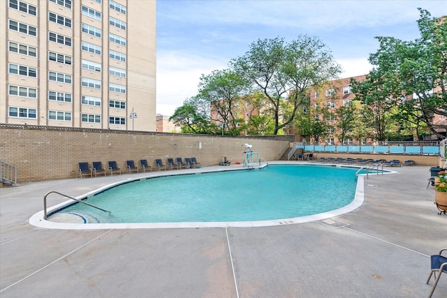 102-30 66th Rd Unit 4B, Forest Hills, NY 11375 - community pool featuring a patio