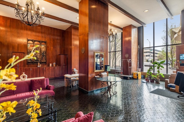 102-30 66th Rd Unit 4B, Forest Hills, NY 11375 - building lobby with wooden walls, beamed ceiling, a high ceiling, and a wall of windows