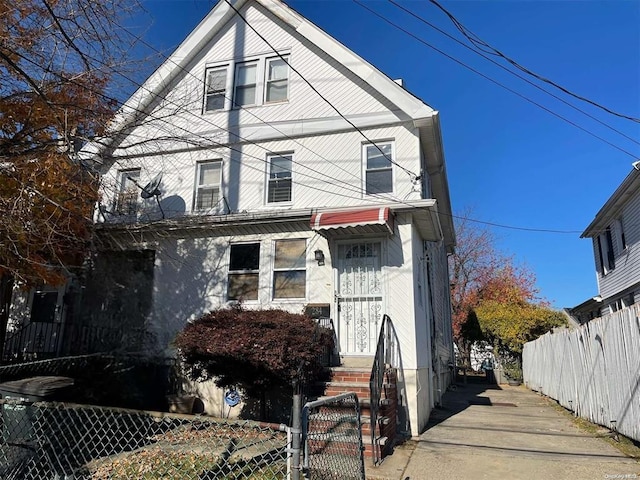 284 Bayview Ave, Inwood, NY 11096 - view of front facade featuring a fenced front yard, a gate, and entry steps