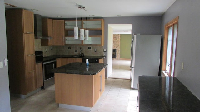 231 Lakeview Rd, Wappingers Falls, NY 12590 - kitchen with stainless steel appliances, wall chimney exhaust hood, decorative backsplash, and light tile patterned floors