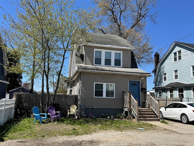 44 Chapman Pl, Bay Shore, NY 11706 - view of front of home with a shingled roof