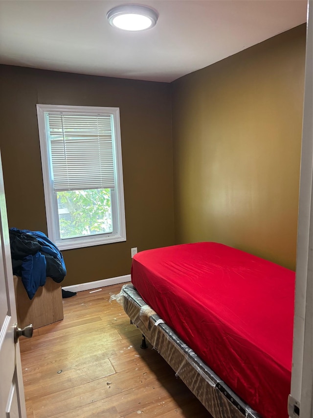 44 Chapman Pl, Bay Shore, NY 11706 - bedroom featuring wood-type flooring and baseboards
