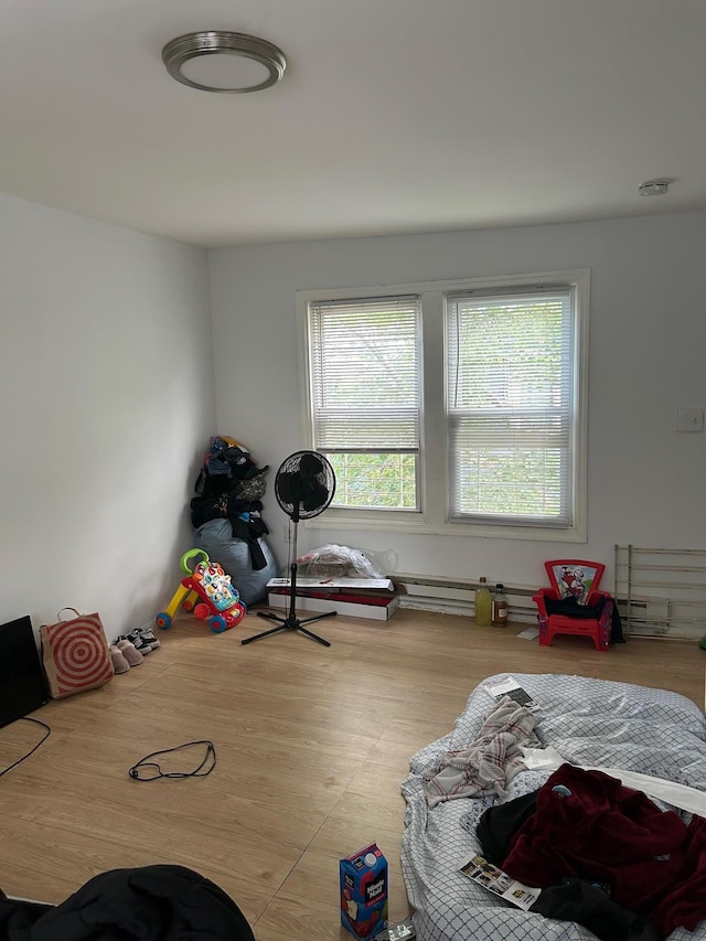 44 Chapman Pl, Bay Shore, NY 11706 - rec room with wood finished floors