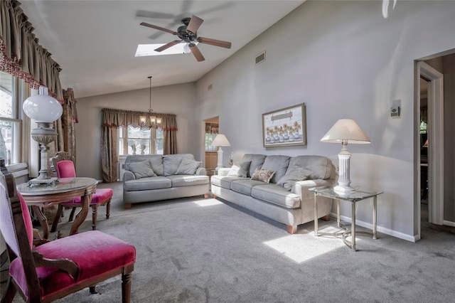 30 W 12th St, Huntington Station, NY 11746 - carpeted living area with ceiling fan, vaulted ceiling, a chandelier, a skylight, and baseboards