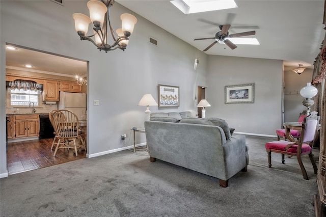 30 W 12th St, Huntington Station, NY 11746 - living room with dark carpet, baseboards, a ceiling fan, and a chandelier