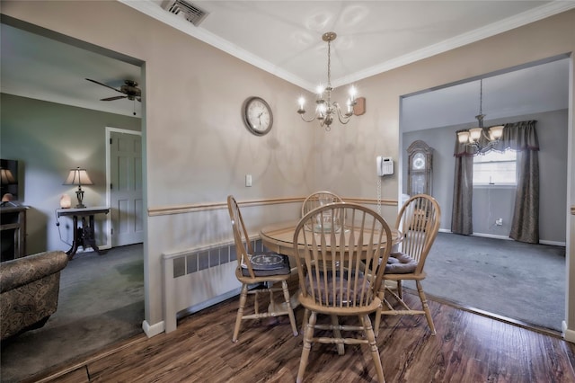 30 W 12th St, Huntington Station, NY 11746 - dining space with a chandelier, radiator heating unit, ornamental molding, baseboards, and wood finished floors
