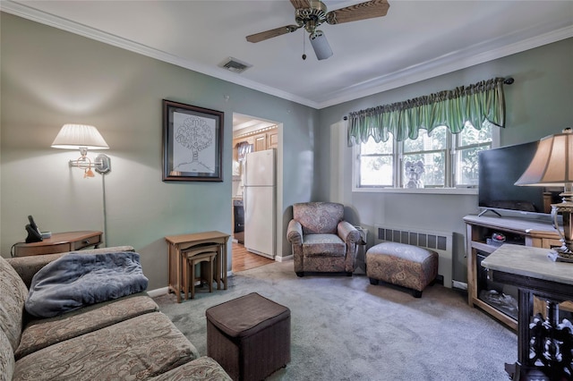 30 W 12th St, Huntington Station, NY 11746 - carpeted living room with a ceiling fan, radiator, ornamental molding, and baseboards