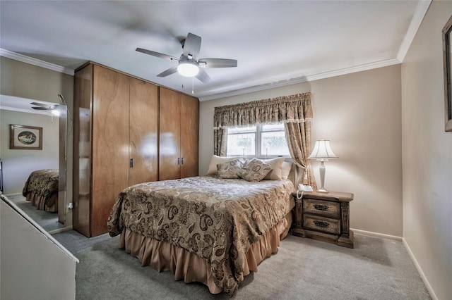 30 W 12th St, Huntington Station, NY 11746 - bedroom featuring a closet, light colored carpet, ornamental molding, baseboards, and a ceiling fan