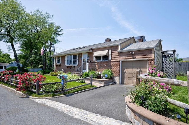30 W 12th St, Huntington Station, NY 11746 - ranch-style home featuring an attached garage, driveway, and a chimney