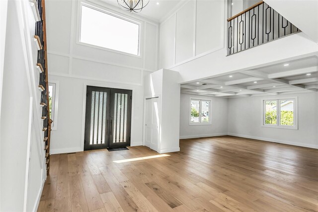 9 Vista Ln, Levittown, NY 11756 - entryway featuring plenty of natural light, baseboards, hardwood / wood-style floors, beamed ceiling, and recessed lighting