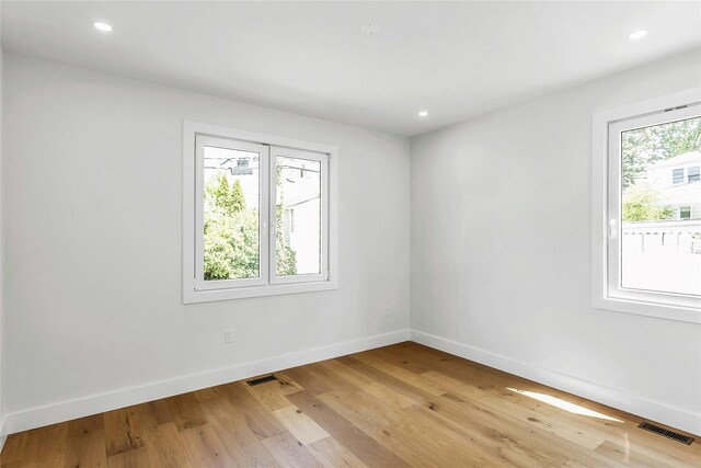 9 Vista Ln, Levittown, NY 11756 - empty room with baseboards, light wood-style floors, and recessed lighting
